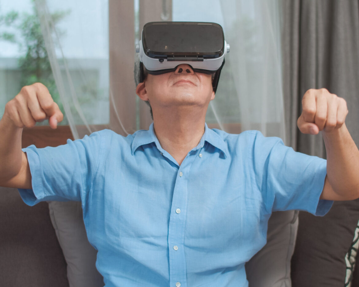 Asian senior men play games at home. Asian senior older Chinese